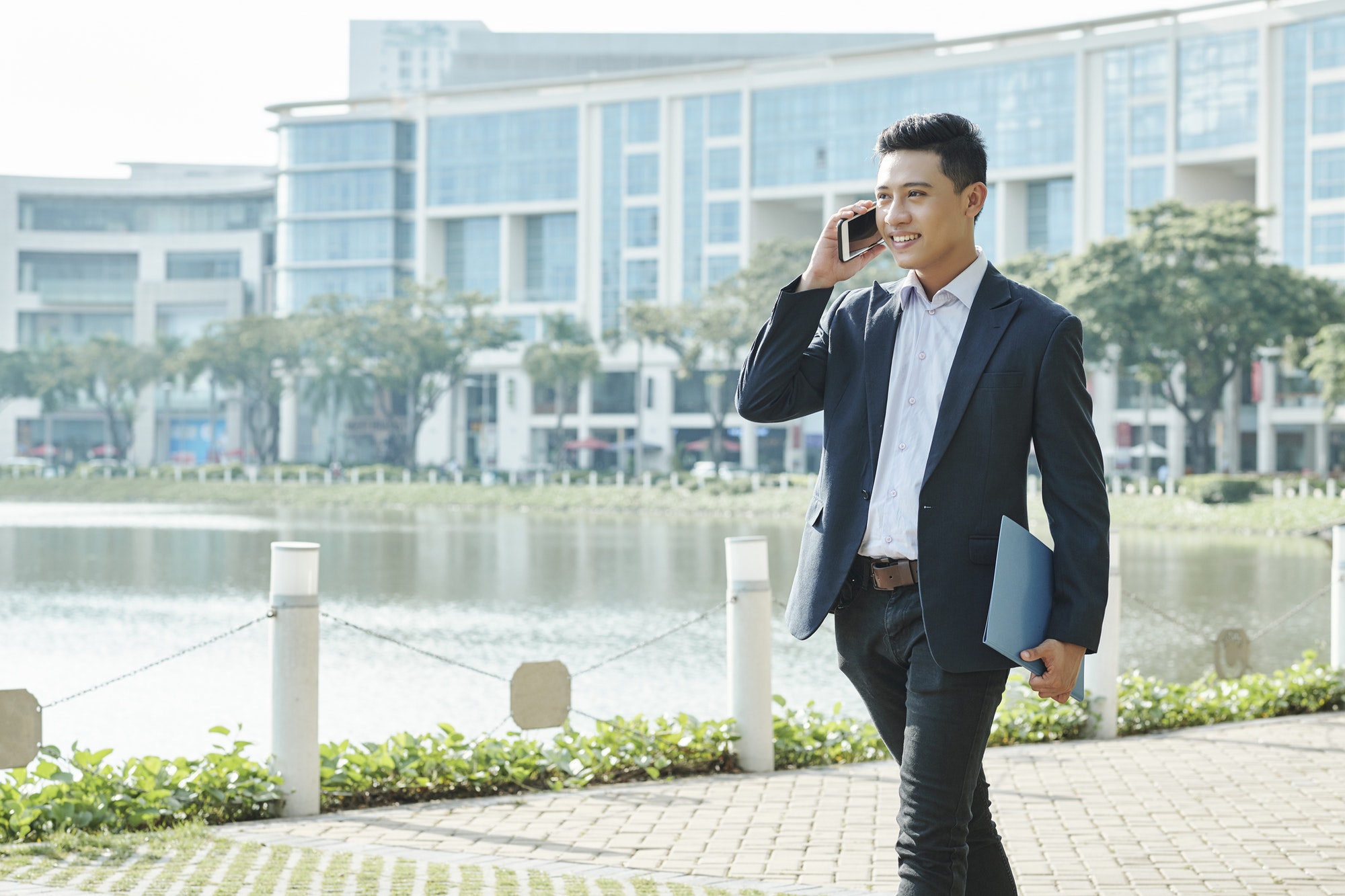 Asian businessman calling on phone