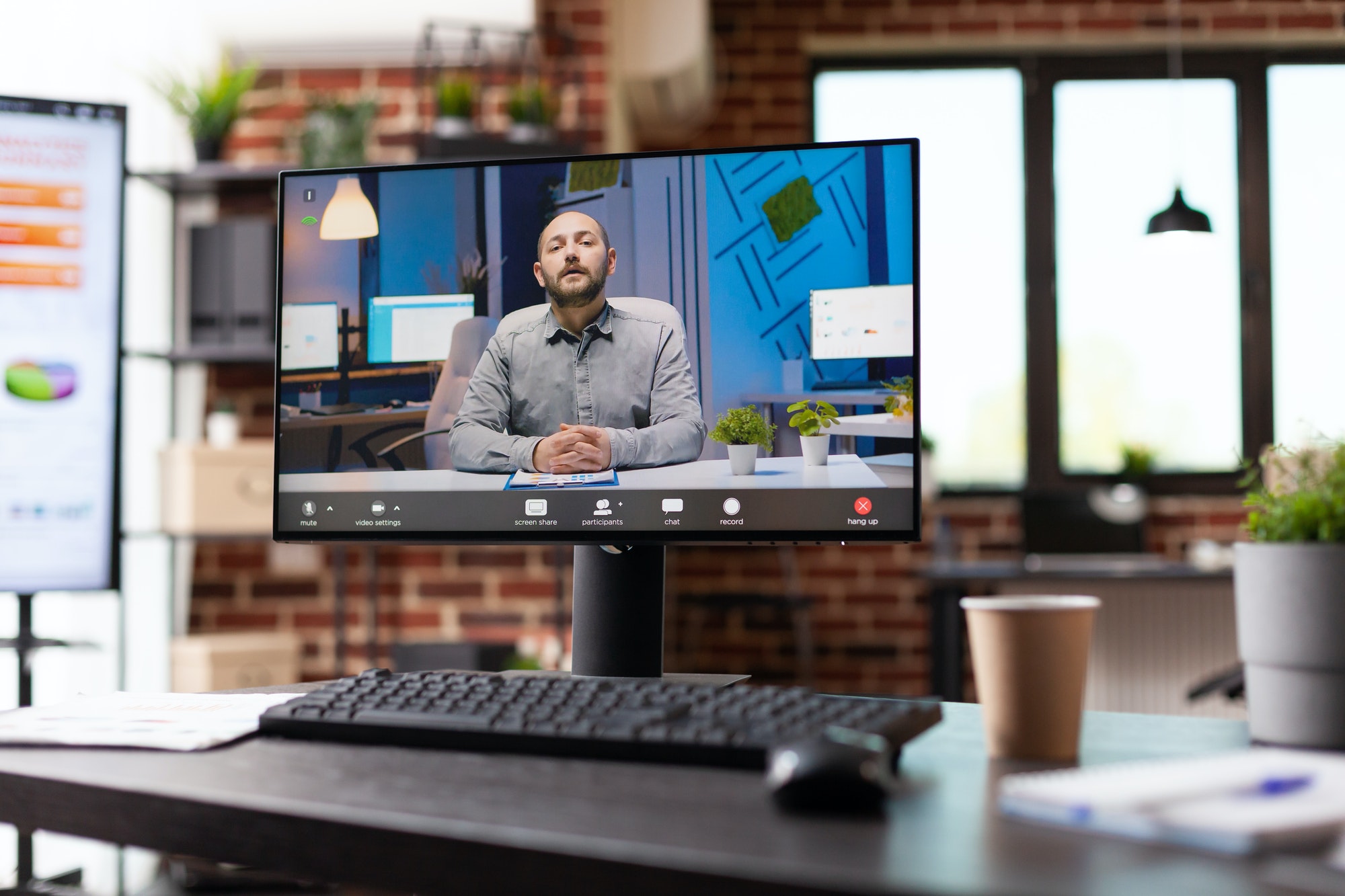 Close up of video call conversation with colleague on monitor